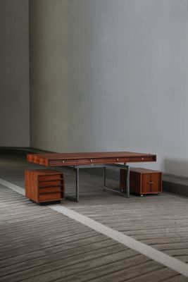 a wooden bench sitting in the middle of a room