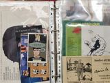 a binder with a lot of papers and pictures on it