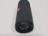 a close up of a speaker on a table with a white background