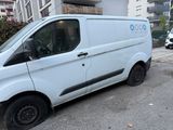 a white van that is parked on the side of the street