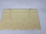 an image of a yellow plastic tray with four holes in it