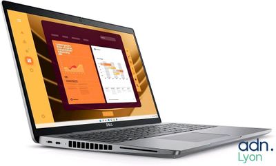 a laptop that is open on a white surface