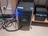 a desktop computer sitting on top of a wooden desk
