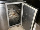 an open refrigerator in the middle of a kitchen