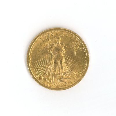 a gold coin on a white surface with a white background