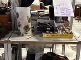 a table with a bunch of items on it in a store