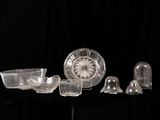 a lot of glass items on a black table