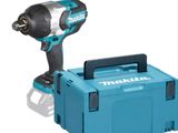 a close up of a cordless drill with a tool box