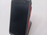 a cell phone that is sitting on top of a stand