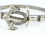 a close up of a bracelet with an anchor on it