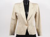 a women ' s beige blazer jacket on a mannequin mannequin mannequin mannequin mannequin mannequin mannequin mann