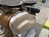 a motor scooter parked on the side of the street