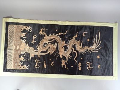 a black and gold dragon banner hanging on the wall