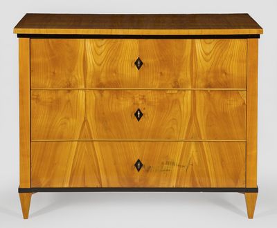 a wooden chest of drawers with three drawers on each side