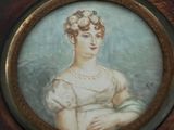 a picture of a woman in a dress in a picture frame