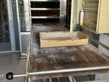 a large oven that is sitting in the middle of a kitchen