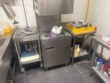 a small kitchen with a sink and a refrigerator in it