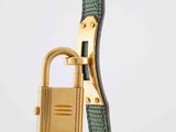 a close up of a green leather bag with a lock on it