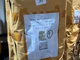 a bag with a sign on it sitting on the ground