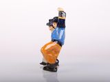 a small figurine of a baseball player holding a bat