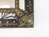 a picture of a mirror hanging on the wall