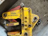 a metal box with a couple of clamps inside of it