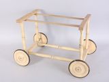 a small wooden cart with wheels on a white background
