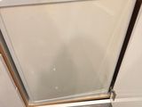 a small white refrigerator in the corner of a kitchen