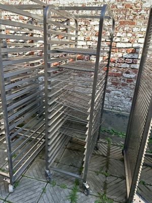 a metal rack that has a bunch of food in it