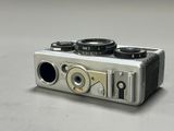 a silver camera that is sitting on a table