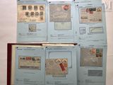 a lot of old stamps on the pages of a book