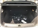 a trunk of a car with a bunch of electronics in it