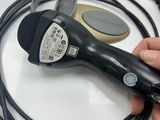 a person holding a corded blow dryer in their hand