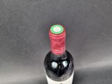 a bottle of wine that is sitting on a table