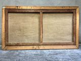 an old wooden frame with a window that has a window in it