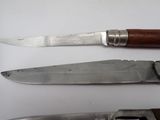 two knives that are sitting next to each other on a table
