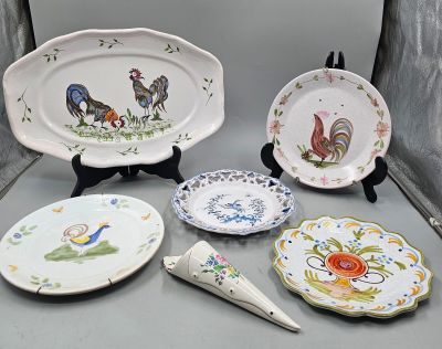 many plates and spoons that are on a table