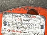 a close up of a piece of metal with a tag on it