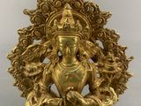 an image of a gold statue of a woman holding a flower
