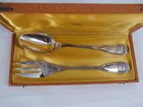 a box with three spoons and a fork in it