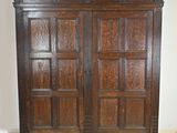 an image of a wooden armoire in a room