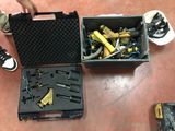 many tools in a case on the floor next to a pair of shoes