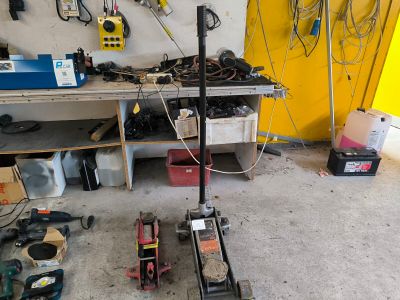 an image of a garage with tools and tools on the floor