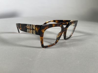 the glasses are made out of tortoises and have a brown frame