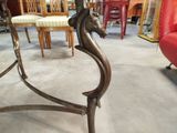 a table with a horse head on it in the middle of a room