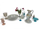 many different vases and bowls and vases on the table