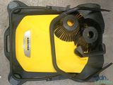 yellow and black cleaning kit sitting on top of a yellow suitcase