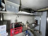 a metal shelf that has a bunch of items on it