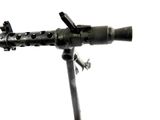 a small machine gun on a tripod on a white background