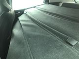 the back seat of a car with a seat belt in the back of it